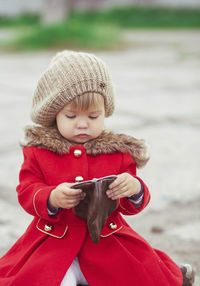 Portrait of cute girl standing at beach