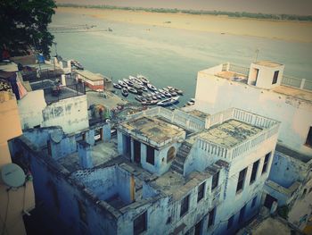 High angle view of townscape by sea