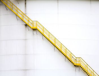 Low angle view of yellow staircase on wall