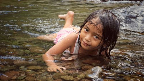 High angle portrait of girl swimming in water