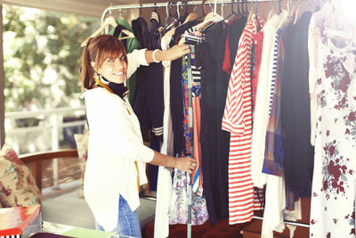 Rear view of woman standing at store