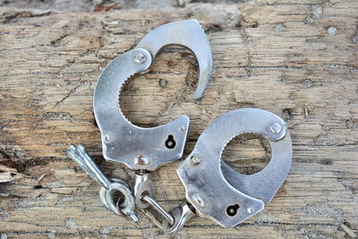 Close-up of handcuffs on textured table