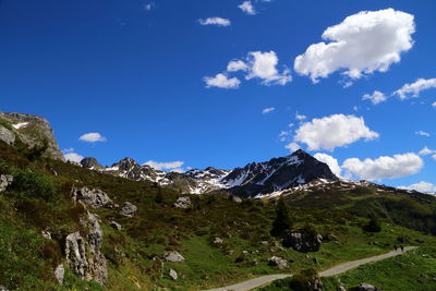 Scenic view of mountains against blue sky