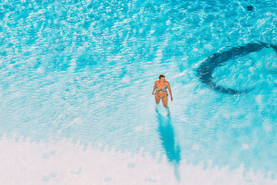 High angle view of man swimming in pool