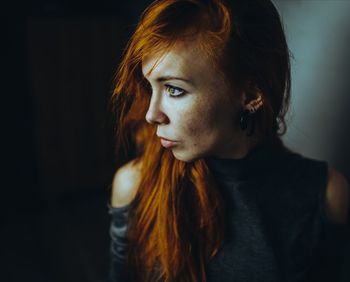 Portrait of young woman looking away