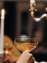 Close-up of hand holding wineglass