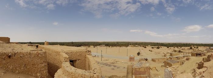 Panoramic view of old ruins against sky