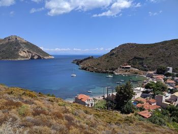 High angle view of sea and buildings against sky