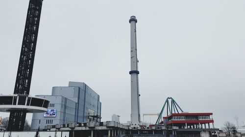 Low angle view of crane against sky