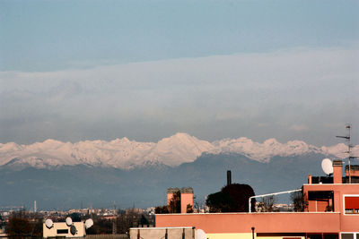 Buildings in city against sky