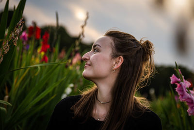 Portrait of young woman looking at camera