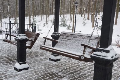 View of empty bench in winter