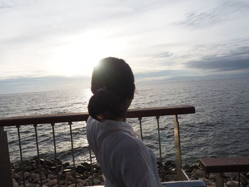 Man looking at sea against sky