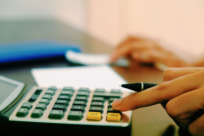 Close-up of hand on table