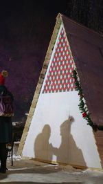 Man with umbrella at night