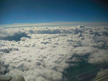 Aerial view of landscape against cloudy sky