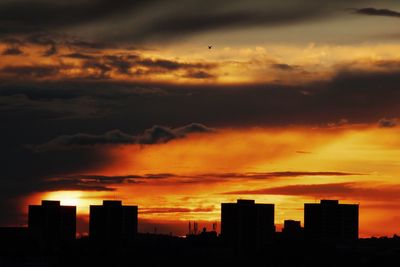 Silhouette of city at sunset