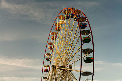 A ferris wheel in bayonne during sunset