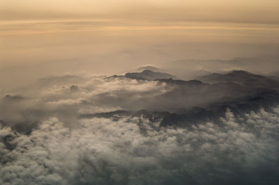 Aerial view of cloudscape against sky during sunset