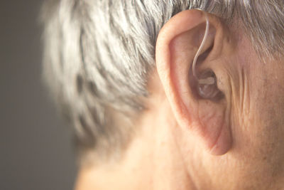 Close-up of man with hearing aid