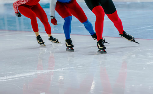 Low section of people walking on floor