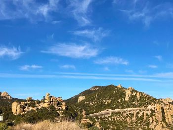 Scenic view of landscape against blue sky