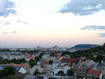 Cityscape against sky during sunset