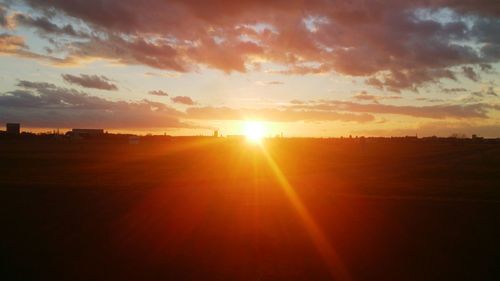 Sun shining through clouds