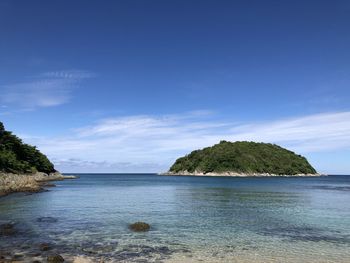 Scenic view of sea against blue sky