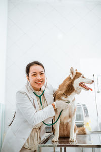 Portrait of female friends with dog