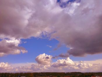 Scenic view of landscape against cloudy sky