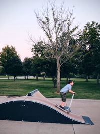 Full length of boy running in park