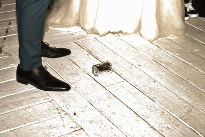 Low section of man standing on footpath