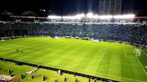 Illuminated lights on soccer field at night