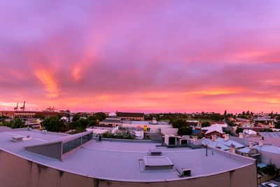 High angle view of buildings against sky at sunset