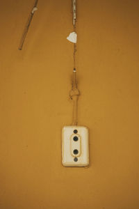 Close-up of electric lamp on wall