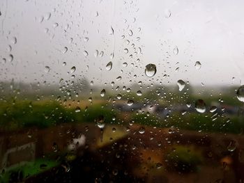 Close-up of raindrops on glass window