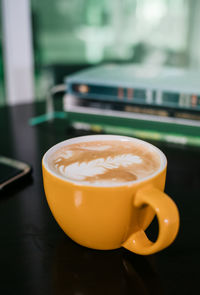 Close-up of cappuccino on table