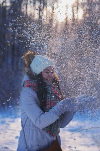 Close-up of person on snow covered landscape