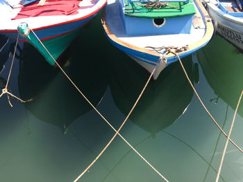 High angle view of boats moored at harbor