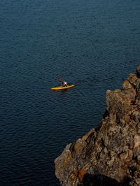 High angle view of man kayaking in sea