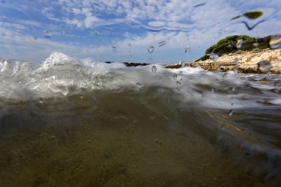 Surface level of beach against sky