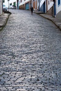 Surface level of cobblestone street in city