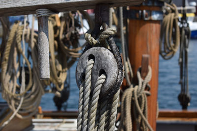 Close-up of rope tied to wooden post