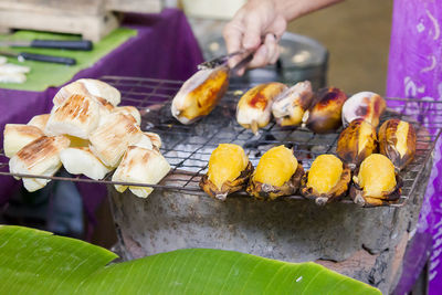 Cassava and roasted banana on the grille for sale in market