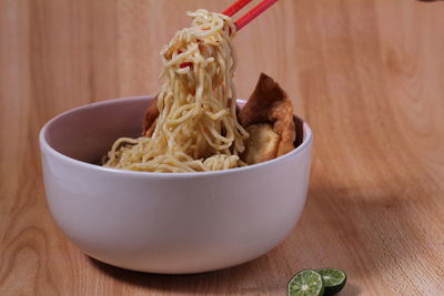 Close-up of noodles in bowl on table