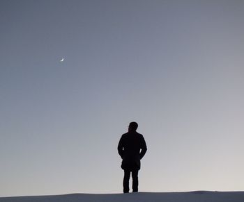 Silhouette man standing against clear sky