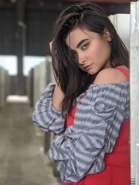 Portrait of beautiful young woman standing outdoors