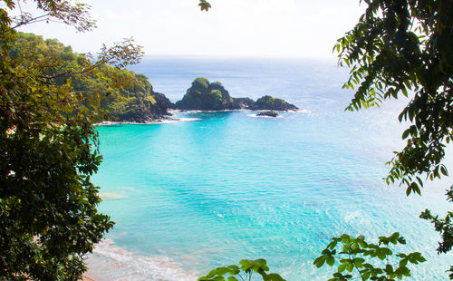 Scenic view of sea against blue sky
