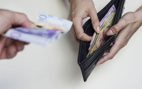 Midsection of person holding hands